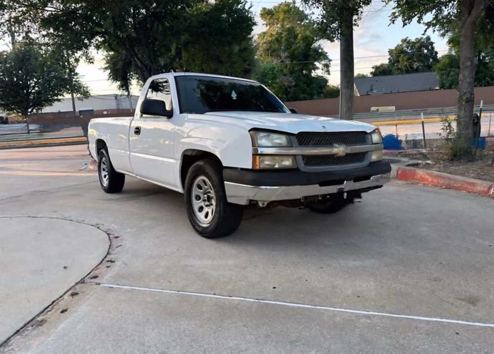Chevy Silverado before new wheels and tires, with factory steel wheels